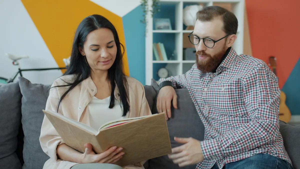 Couple reading together at home